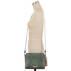 Carrie Crossbody Emerald Moa on figure for scale
